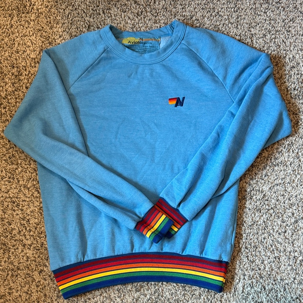 Aviator Nation Light Blue Crewneck with Rainbow Stripe Cuffs & Hem